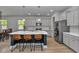 Modern kitchen with a large center island, stainless steel appliances, and sleek gray cabinetry at 456 Cattle Drive Circle, Myrtle Beach, SC 29588