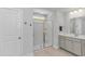 This bathroom has a sink with light gray cabinets and a glass-enclosed shower at 456 Cattle Drive Circle, Myrtle Beach, SC 29588