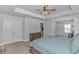 The spacious main bedroom features a walk-in closet and cozy carpeting throughout at 456 Cattle Drive Circle, Myrtle Beach, SC 29588