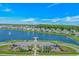 Aerial view of playground and lake with surrounding homes in the community at 456 Cattle Drive Circle, Myrtle Beach, SC 29588