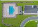Aerial view of community pool and pool house, surrounded by green space and parking at 456 Cattle Drive Circle, Myrtle Beach, SC 29588