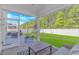 Relaxing screened-in porch with comfortable seating overlooking the spacious backyard at 456 Cattle Drive Circle, Myrtle Beach, SC 29588