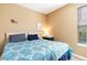 Bright bedroom featuring twin beds with patterned bedding and a side table with a lamp at 488 River Oaks Dr. # 61F, Myrtle Beach, SC 29579