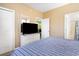 Comfortable bedroom with TV on a dresser, closet, and bathroom entrance for added convenience at 488 River Oaks Dr. # 61F, Myrtle Beach, SC 29579