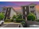 Condominium buildings featuring brick and siding, balconies, and well-kept landscaping at 488 River Oaks Dr. # 61F, Myrtle Beach, SC 29579