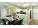 Bright kitchen with white cabinets, stainless steel appliances, and an adjacent dining area at 488 River Oaks Dr. # 61F, Myrtle Beach, SC 29579