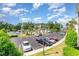 View of the parking lot with mature trees and well-maintained landscaping at 488 River Oaks Dr. # 61F, Myrtle Beach, SC 29579