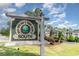 Community sign for River Oaks Golf and Tennis Resort II South with lush landscaping at 488 River Oaks Dr. # 61F, Myrtle Beach, SC 29579