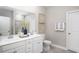 Bright bathroom featuring a double vanity, decorative towels, and large mirror at 527 Magnolia Terrace Dr, Myrtle Beach, SC 29579