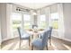 Sunlit breakfast nook with large windows, a modern light fixture, and comfortable seating at 527 Magnolia Terrace Dr, Myrtle Beach, SC 29579