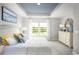Serene bedroom with tray ceiling, large windows, and neutral tones for a relaxing retreat at 527 Magnolia Terrace Dr, Myrtle Beach, SC 29579