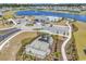 Aerial view of community playground, pool, clubhouse and tranquil lake with beautiful fountain at 528 Courtridge Loop, Conway, SC 29526