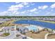 Overhead shot of the community pool and clubhouse next to a large lake with a fountain at 528 Courtridge Loop, Conway, SC 29526