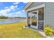 Charming screened back porch, offers a tranquil view and a seamless transition to the outdoors at 528 Courtridge Loop, Conway, SC 29526