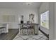 Bright dining area featuring stylish rug, chandelier, decorative mirror, and seating for four, perfect for casual meals at 528 Courtridge Loop, Conway, SC 29526