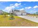 Charming home featuring a two-car garage, well-manicured lawn and lush landscaping with palm trees at 528 Courtridge Loop, Conway, SC 29526