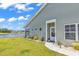 Beautiful home exterior showcasing a serene pond view, well-kept lawn, and tasteful landscaping at 528 Courtridge Loop, Conway, SC 29526