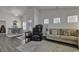 Bright and open living room with modern furnishings, stylish decor, and lots of natural light at 528 Courtridge Loop, Conway, SC 29526