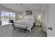 Bright main bedroom with vaulted ceiling, large windows, and a serene view overlooking the lake at 528 Courtridge Loop, Conway, SC 29526