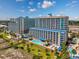 Expansive aerial view of a beachfront resort featuring multiple pools, palm trees, and inviting ocean access at 5300 N Ocean Blvd. # 422, Myrtle Beach, SC 29572