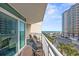 Relaxing balcony space with seating and beautiful ocean views at 5300 N Ocean Blvd. # 422, Myrtle Beach, SC 29572