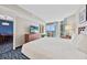 Bright bedroom with balcony access and ocean views, featuring a king bed and comfortable furniture at 5300 N Ocean Blvd. # 422, Myrtle Beach, SC 29572