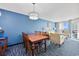 Comfortable dining area with seating for six, bright lighting, and balcony access with ocean views at 5300 N Ocean Blvd. # 422, Myrtle Beach, SC 29572