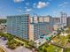 The exterior view showcasing modern condos and inviting pool amenities and palm trees enhance outdoor appeal at 5300 N Ocean Blvd. # 422, Myrtle Beach, SC 29572