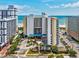 Hotel's exterior view showcases modern architecture, an inviting entrance, and convenient parking near the beach at 5300 N Ocean Blvd. # 422, Myrtle Beach, SC 29572