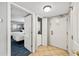 Hallway shot featuring a washer and dryer behind one door and a bedroom visible through another at 5300 N Ocean Blvd. # 422, Myrtle Beach, SC 29572