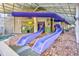 Indoor waterpark showing water slides and access to a pool, designed for thrilling aquatic adventures at 5300 N Ocean Blvd. # 422, Myrtle Beach, SC 29572