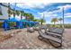 Upscale pool area with lounge chairs under blue canopies, providing a perfect relaxation spot under palm trees at 5300 N Ocean Blvd. # 422, Myrtle Beach, SC 29572