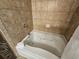 Luxurious bathroom with a soaking tub and tile surround for ultimate relaxation at 5300 N Ocean Blvd. # 518, Myrtle Beach, SC 29577