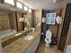 Well-lit bathroom featuring a vanity with granite countertop and decorative wall art at 5300 N Ocean Blvd. # 518, Myrtle Beach, SC 29577