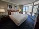 Charming bedroom with balcony access, comfortable bed, and serene ocean views at 5300 N Ocean Blvd. # 518, Myrtle Beach, SC 29577