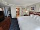 Bright bedroom with ensuite bathroom features a comfortable bed, dresser, and coastal decor at 5300 N Ocean Blvd. # 518, Myrtle Beach, SC 29577
