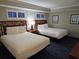 Cozy bedroom with two beds, soft lighting, and nautical decorations create a relaxing atmosphere at 5300 N Ocean Blvd. # 518, Myrtle Beach, SC 29577