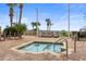 Inviting in-ground hot tub on a brick patio with lounge chairs and palm trees at 5300 N Ocean Blvd. # 518, Myrtle Beach, SC 29577