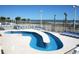 Relaxing lazy river with beach access surrounded by lounge chairs at 5300 N Ocean Blvd. # 518, Myrtle Beach, SC 29577