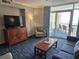 Inviting living area with a balcony offering ocean views, comfortable seating, and a warm ambiance at 5300 N Ocean Blvd. # 518, Myrtle Beach, SC 29577