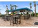 Outdoor bar with seating and palm trees, perfect for beachside relaxation at 5300 N Ocean Blvd. # 518, Myrtle Beach, SC 29577