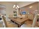 Elegant dining area with modern lighting fixture, shiplap accent wall and neutral decor at 534 Magnolia Terrace Dr, Myrtle Beach, SC 29579