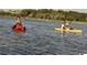 Two people kayaking on the water, highlighting the water sports available at 534 Magnolia Terrace Dr, Myrtle Beach, SC 29579