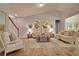 Bright, open living room with hardwood floors and neutral decor and stairway at 534 Magnolia Terrace Dr, Myrtle Beach, SC 29579
