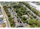 Overhead view of residential neighborhood showcasing lush trees, community pool and pond, and well-maintained townhome community at 55 Shadow Moss Pl. # 55, North Myrtle Beach, SC 29582