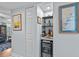 Chic bar area with built-in wine cooler, shelving, and decor enhancing the home's entertainment appeal at 55 Shadow Moss Pl. # 55, North Myrtle Beach, SC 29582