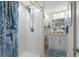 Bright bathroom with modern vanity, walk-in shower, and nautical-themed decor, offering a stylish and functional space at 55 Shadow Moss Pl. # 55, North Myrtle Beach, SC 29582
