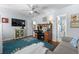 Inviting bedroom with a large TV, decorative cabinet, and a view of the en-suite bathroom with a turtle themed shower curtain at 55 Shadow Moss Pl. # 55, North Myrtle Beach, SC 29582