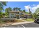 Charming community clubhouse with neat landscaping, manicured lawn and an American flag flying out front at 55 Shadow Moss Pl. # 55, North Myrtle Beach, SC 29582