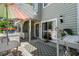 Charming outdoor patio space with views of the home's exterior and well-manicured surroundings with comfortable seating at 55 Shadow Moss Pl. # 55, North Myrtle Beach, SC 29582